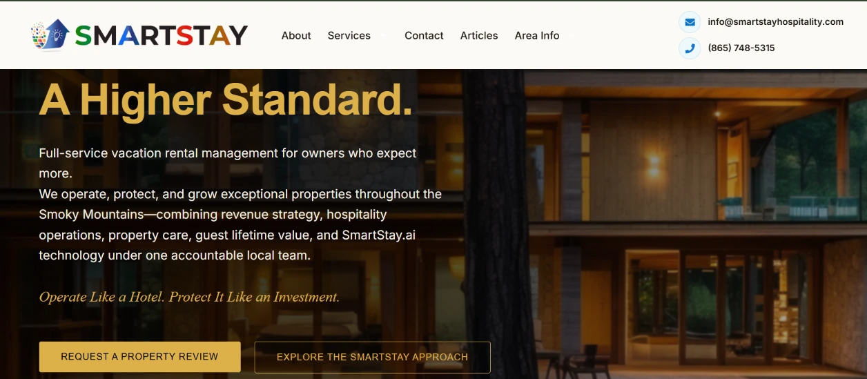 SmartStay Hospitality website hero with a cabin backdrop, gold headline and property-review call to action